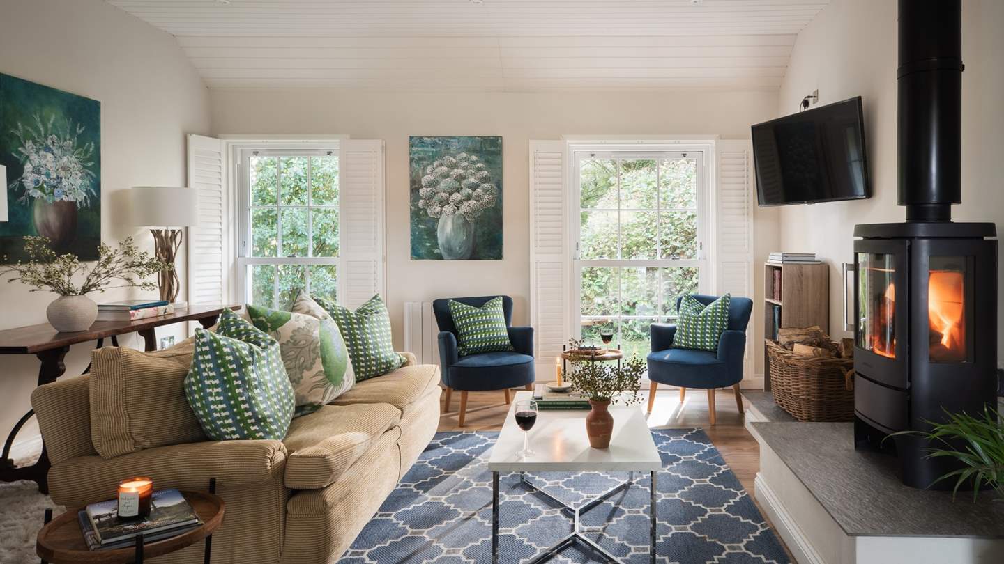 Discover the homely open plan living area, where botanical artwork makes this a soothing place to unwind... 