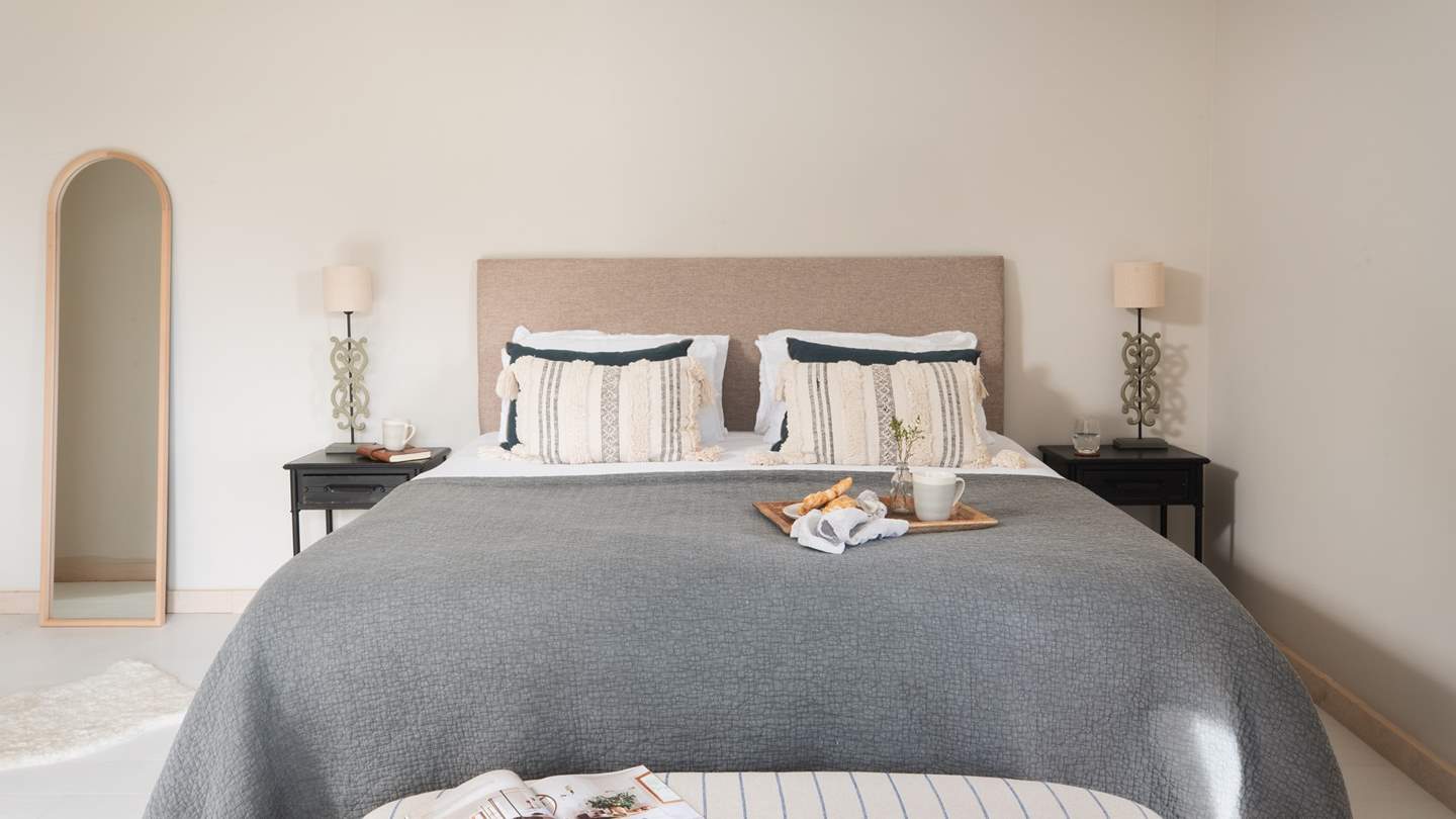 Settled in its own annex, the fourth bedroom is a Scandi paradise with silky cream walls and jet-black features 