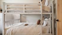 The adorable bunk bedroom promises the sweetest of bedtimes for the little ones