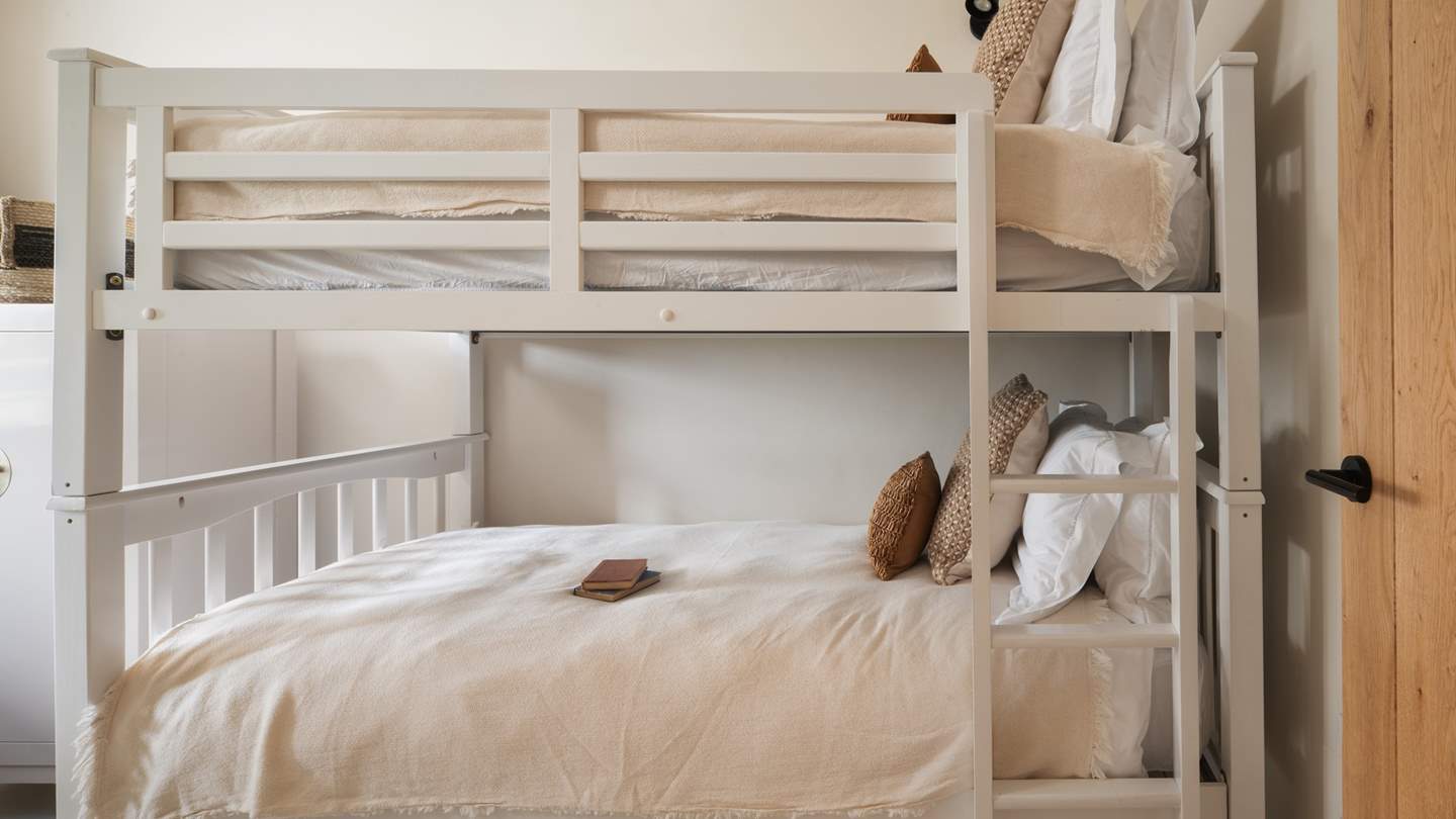 The adorable bunk bedroom promises the sweetest of bedtimes for the little ones