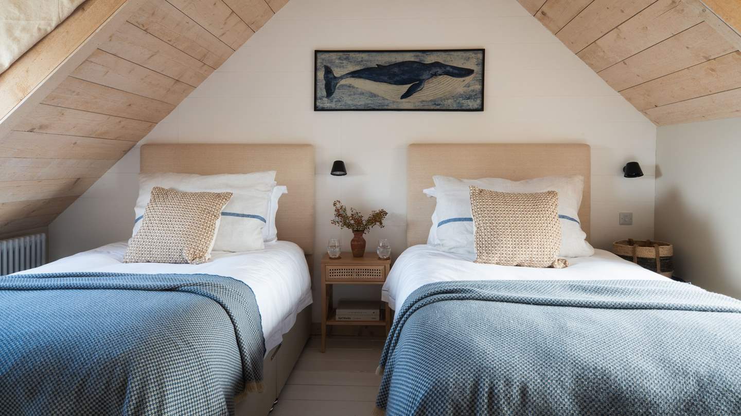 Complementary dashes of blue add a beautiful coastal touch to this boudoir 