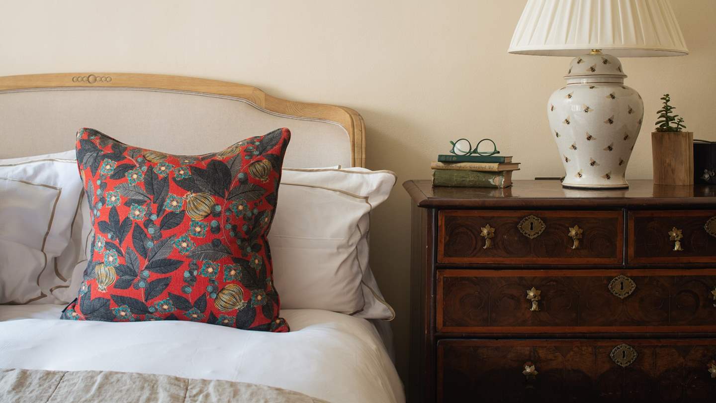 A lavish king-sized bed awaits, in harmony with darling antique touches 