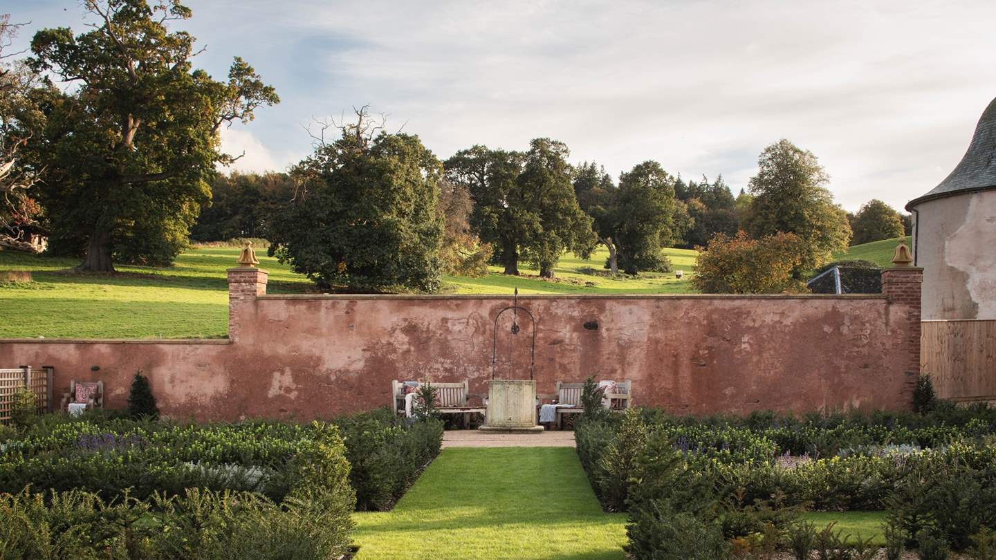 During the warmer months, while away blissful days in this magical setting with two garden benches...