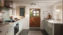We just adore the quirky stable door in the rustic kitchen