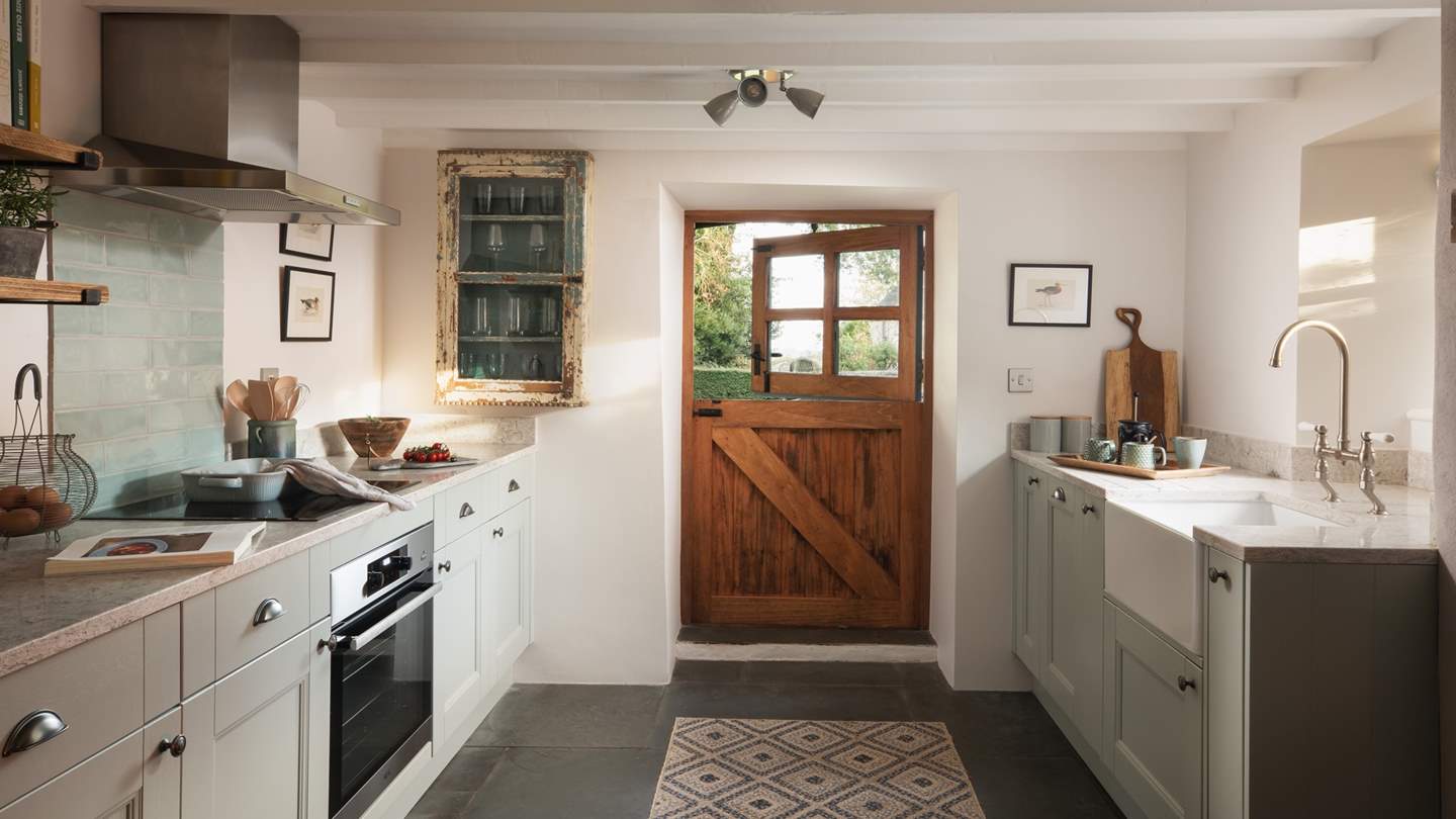 We just adore the quirky stable door in the rustic kitchen
