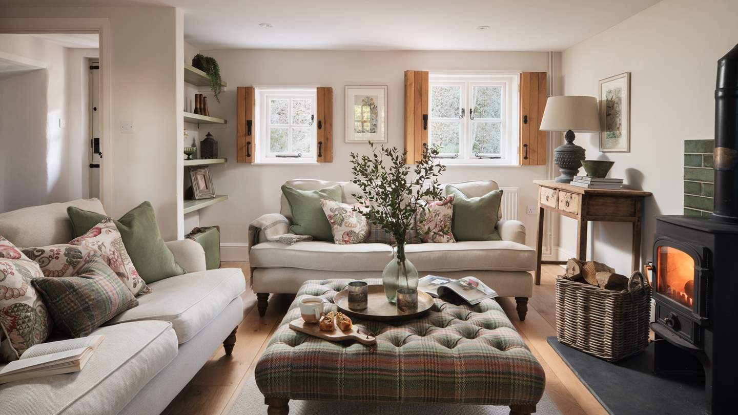 Step inside the snug country living room, where exquisite green tones and rustic interiors promise those heavenly slow living moments