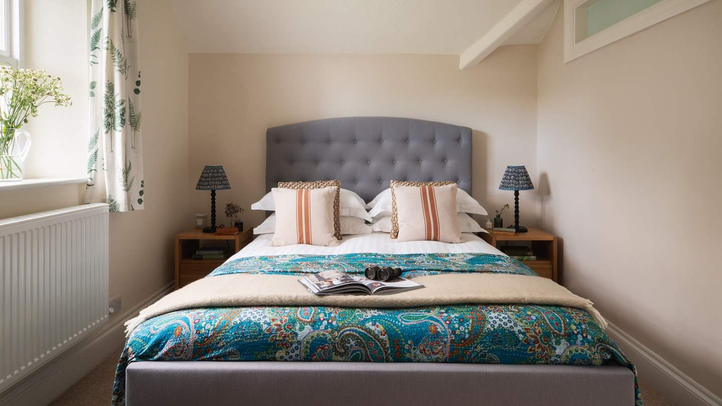 Bedroom three with a king-sized bed is another masterclass in tranquillity