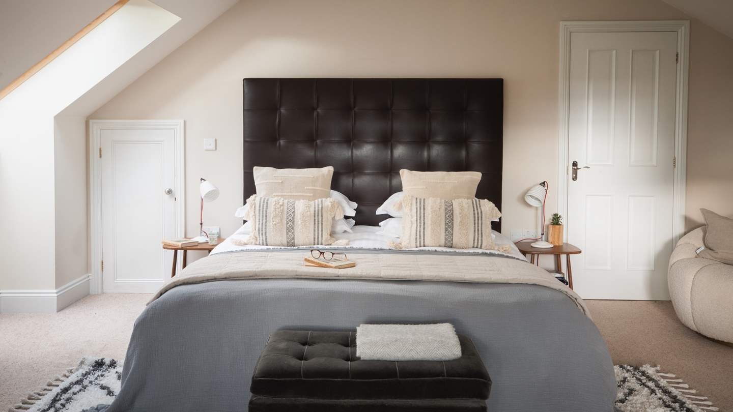 Breakfasts in bed are a must in bedroom one as the sumptuous, super-king bed looks out across the balcony and over the garden