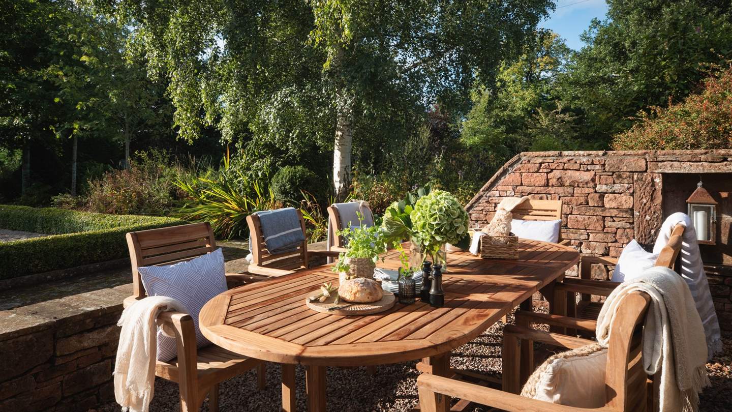 Beautiful teak furniture basks in the last light of the day, providing endless opportunities for some sun-soaked alfresco dining surrounded by loved ones