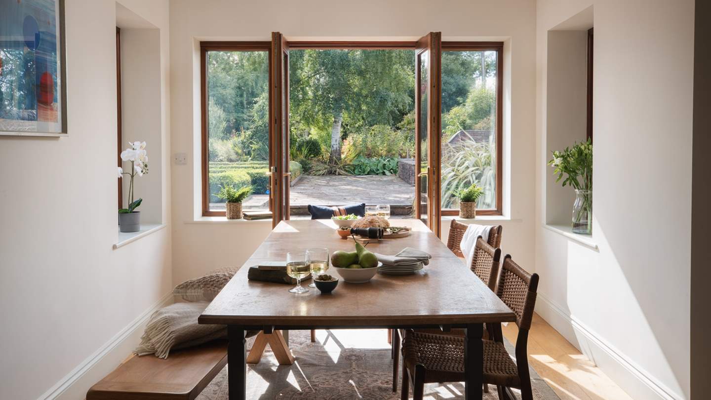 Just around the corner from the kitchen and making the most of the garden vista, the dining table promises slow mornings and delicious dining