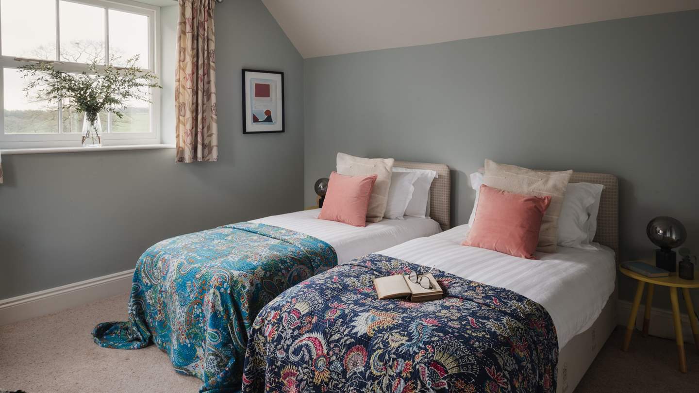 Light-filled and airy, the gorgeous fourth bedroom features a super king zip-and-link bed, which can also be set as twin beds

