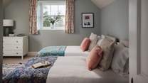 Calling for slow mornings and restful nights, the fourth bedroom is simply a delight