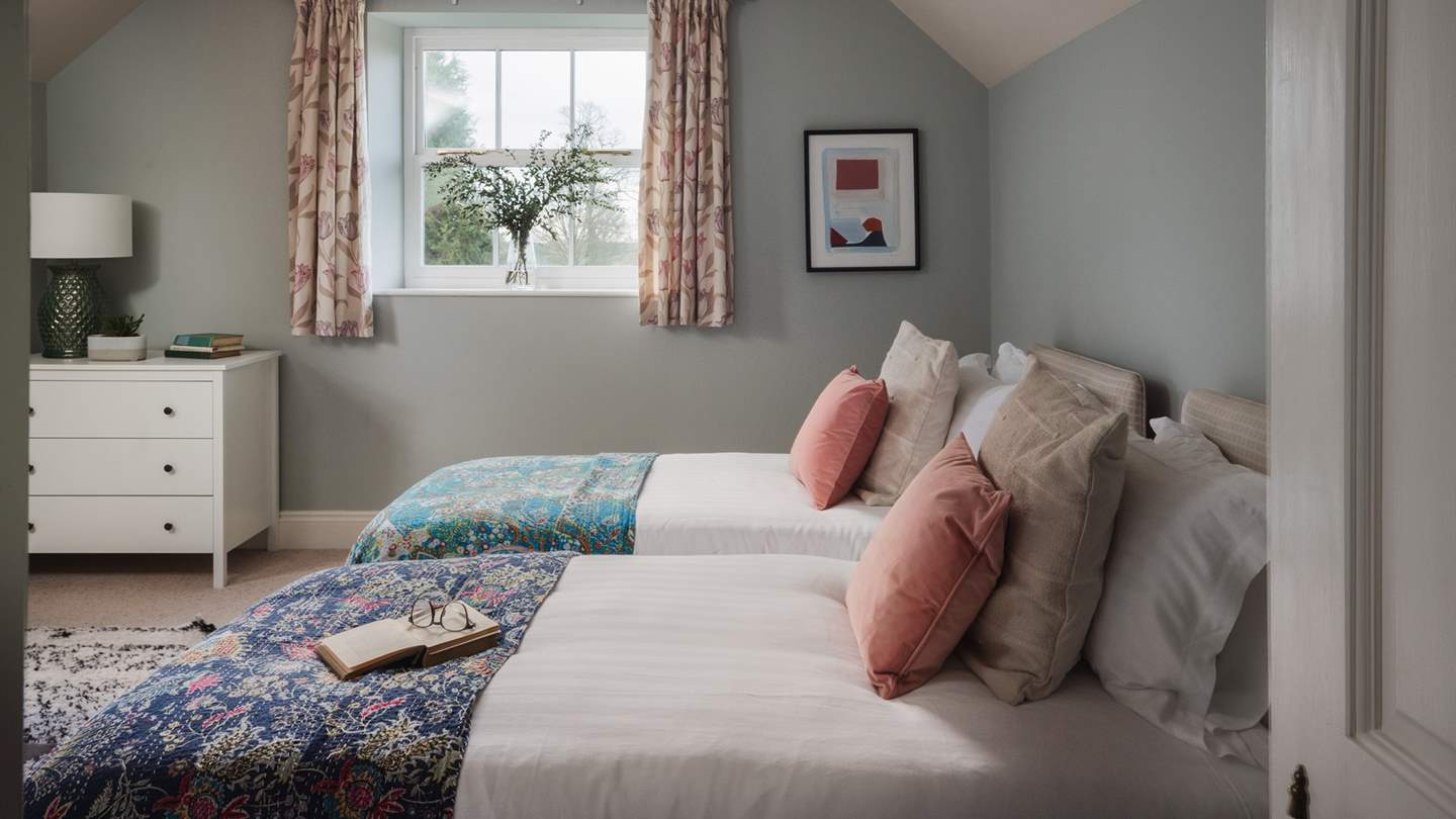 Calling for slow mornings and restful nights, the fourth bedroom is simply a delight