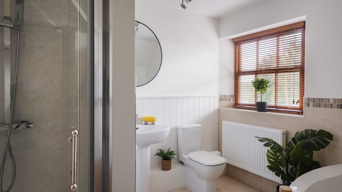 The spacious family bathroom also has a separate shower... 