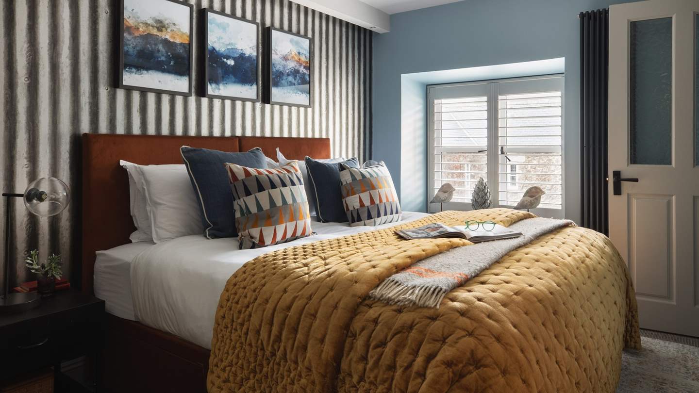 The first bedroom is a soothing space to unwind 