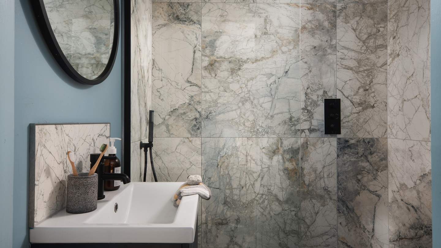 We love the marble effect tiles in the ensuite shower room 