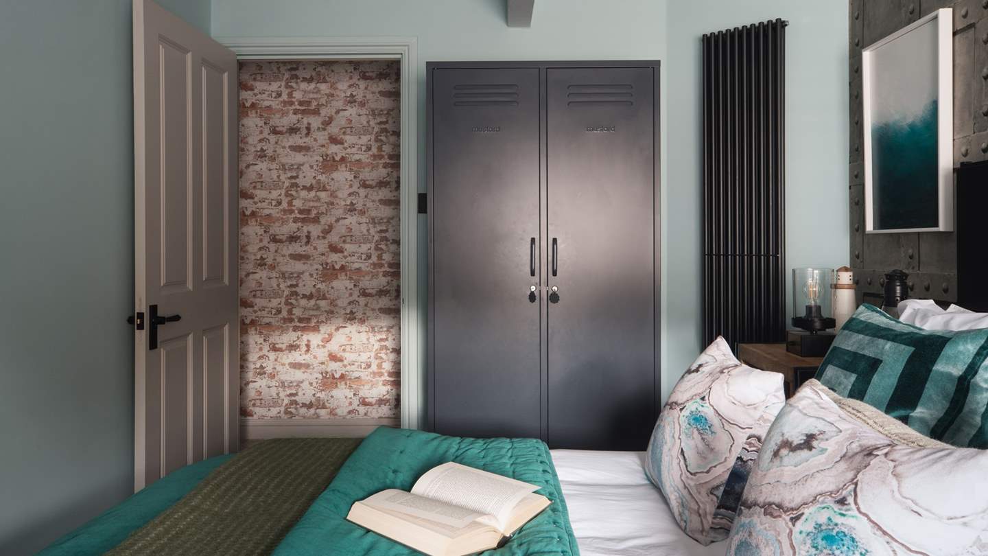 The second bedroom is dressed in calming blue tones 

