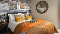 The third bedroom has a comfy king-sized bed, dressed with gorgeous rustic décor 