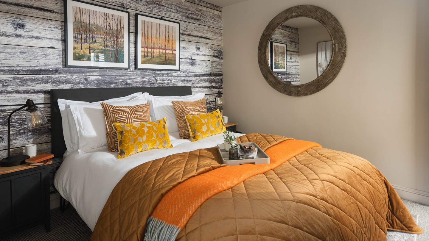 The third bedroom has a comfy king-sized bed, dressed with gorgeous rustic décor 