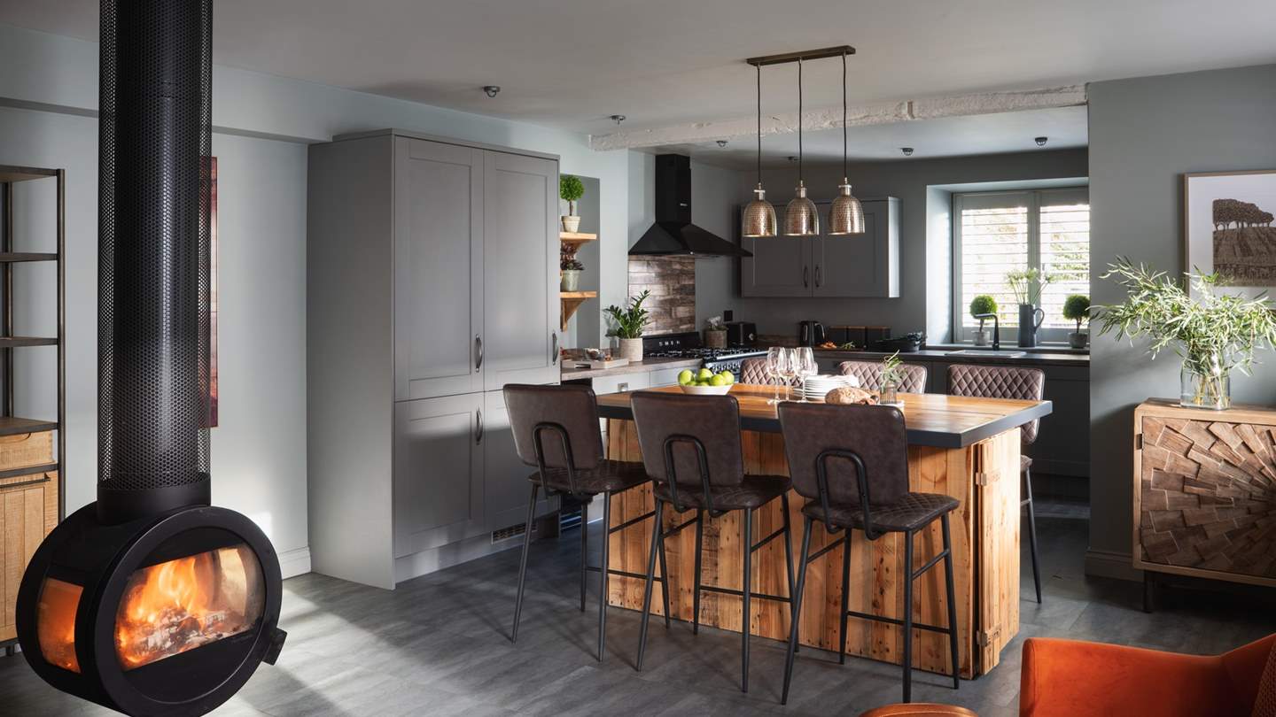 The log burner is perfectly positioned in the middle of the room to create a warming atmosphere on chilly nights