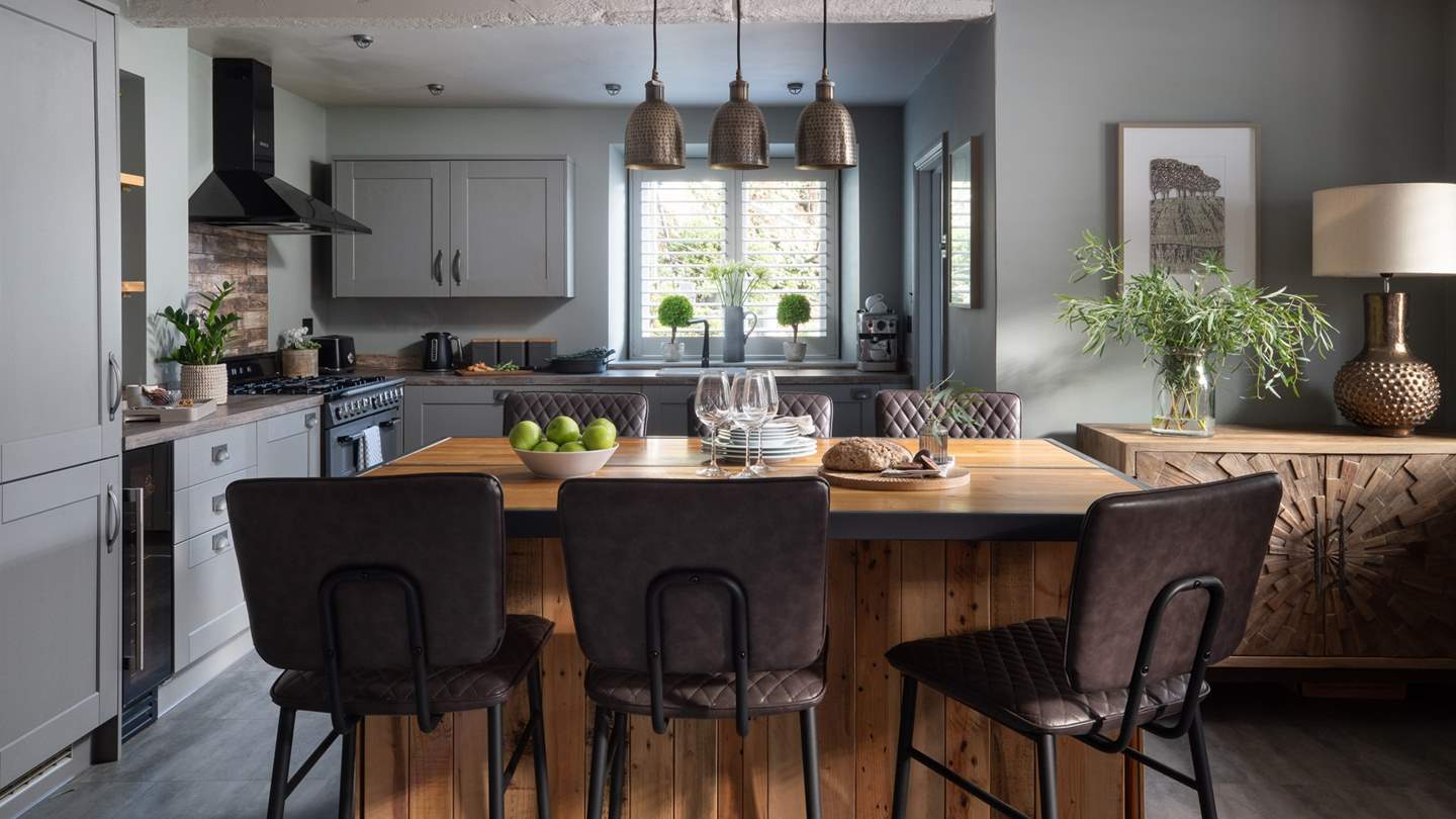 Gather around the rustic six-seater breakfast bar for laid back meals 