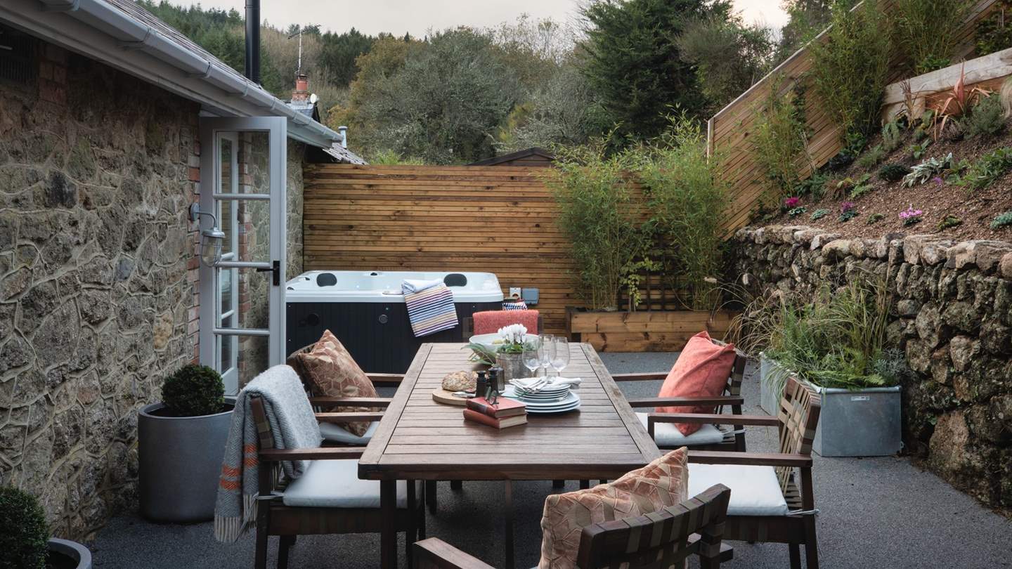 A bubbling hot tub awaits on the first level of the garden