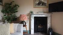 With a beautiful feature marble fireplace and lamps to set the mood