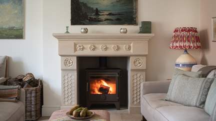 Settle beside the ornate fireplace and delve into a new book in our characterful cottage