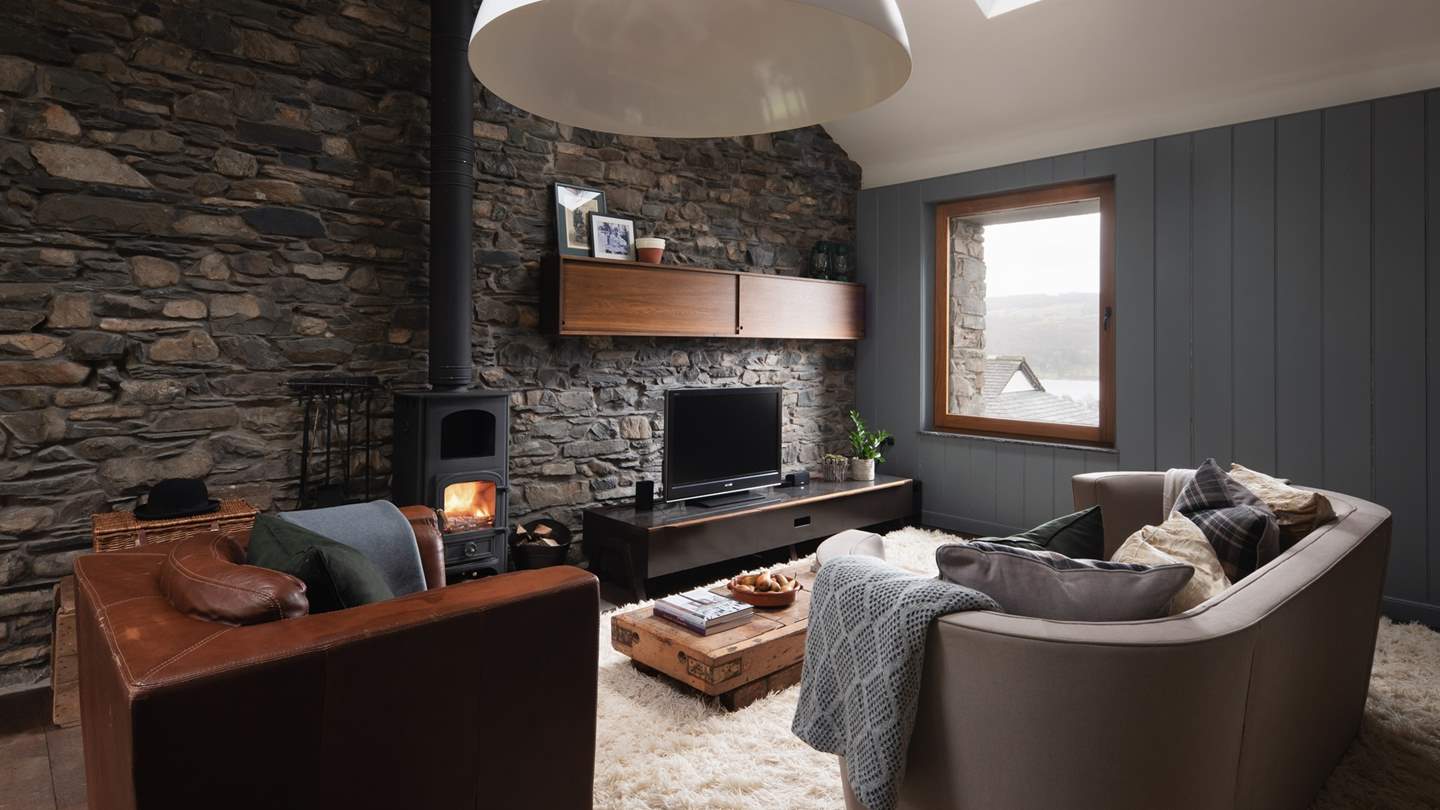 In the separate barn, the stunning open-plan living space is an aesthetic dream