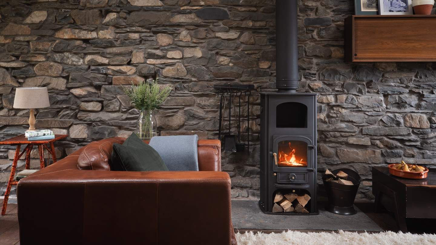 Settle around the flickering wood-burning stove in the colder months