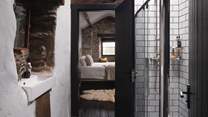 Through the adjoining door, you’ll find a stylish ‘Jack and Jill’ bathroom which leads to the quirky bunk bedroom