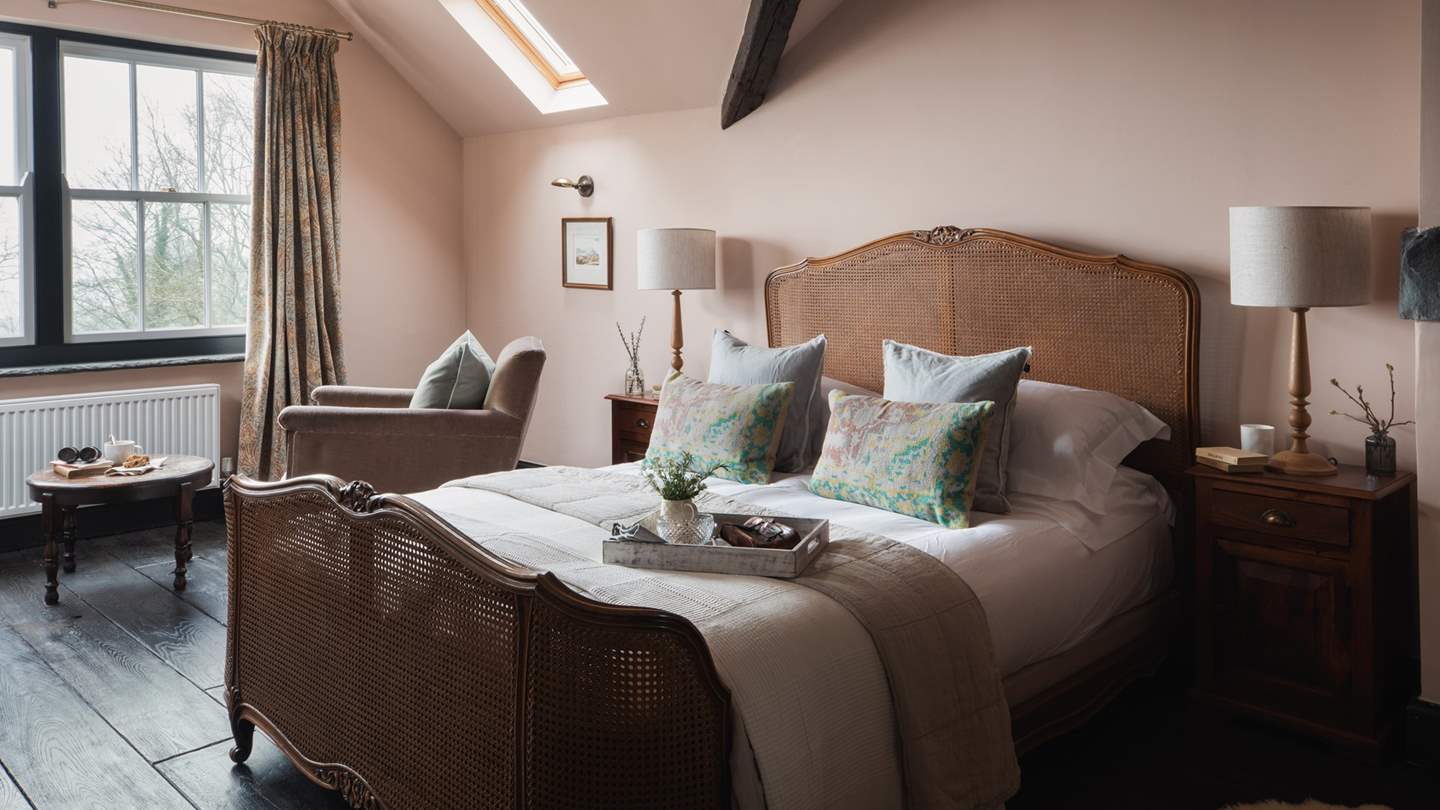 Uncover the powder-pink master bedroom of dreams, boasting spellbinding views over Coniston Water...