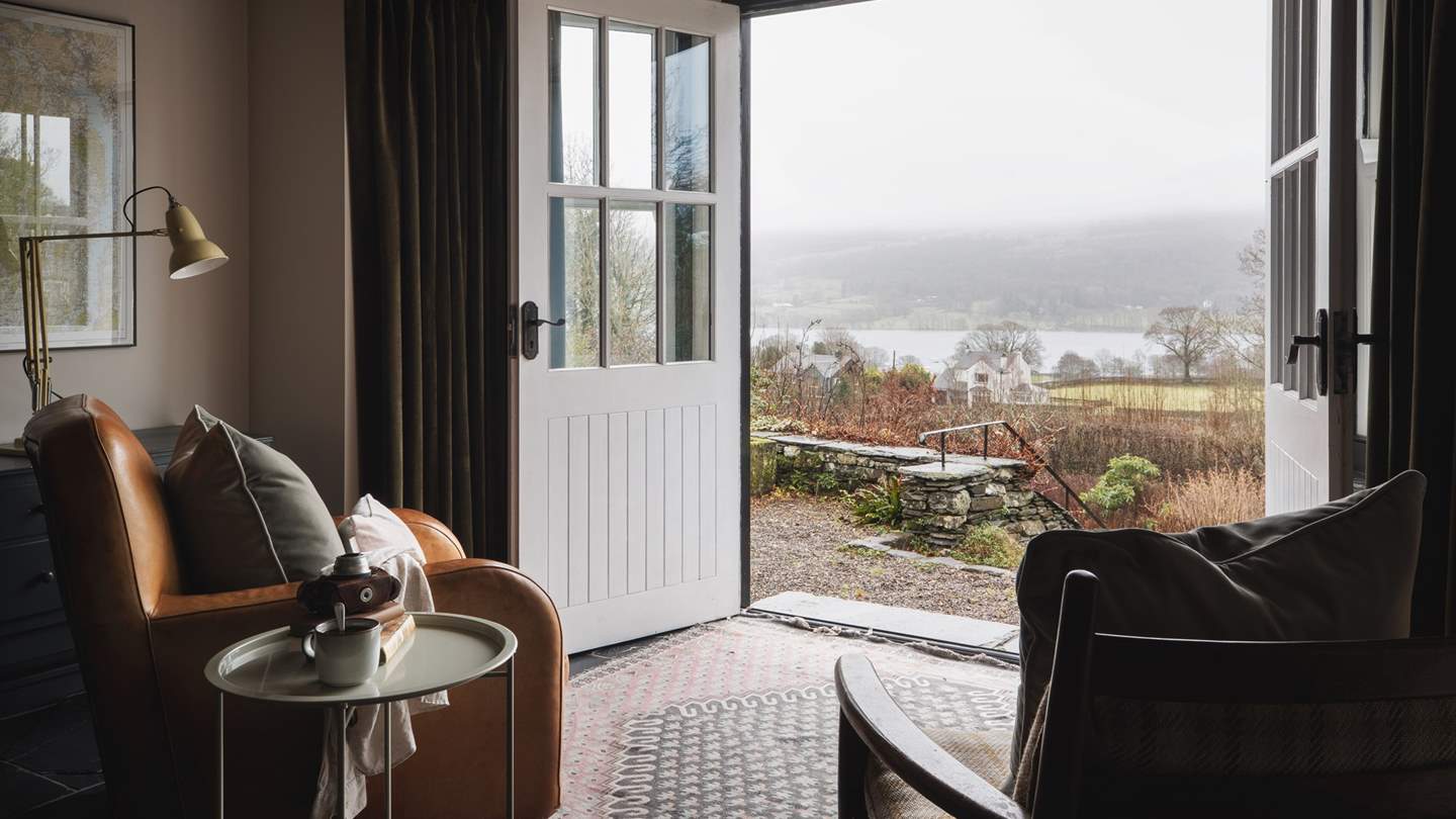 French doors lead onto the idyllic terrace, overlooking the glistening lake – a stunning spot to reside whilst sipping your morning coffee...