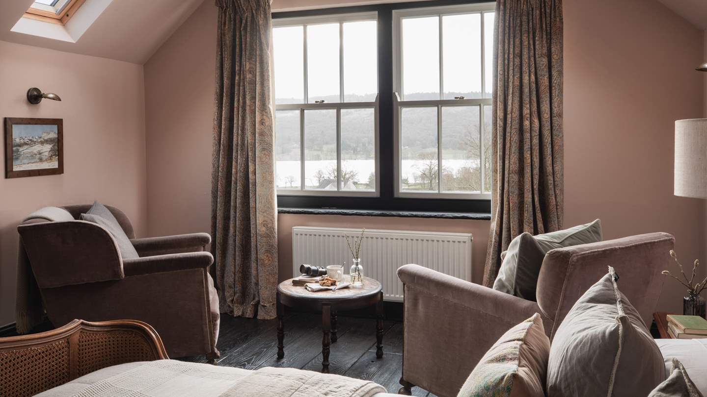 Two blush pink armchairs await for moments of quietude and a good book...