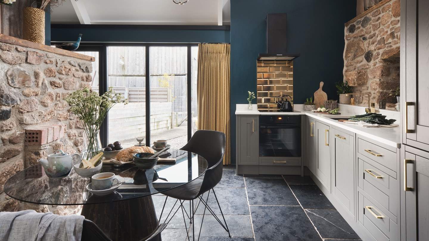 The spacious eat-in kitchen is a beautifully curated space for creating culinary delights