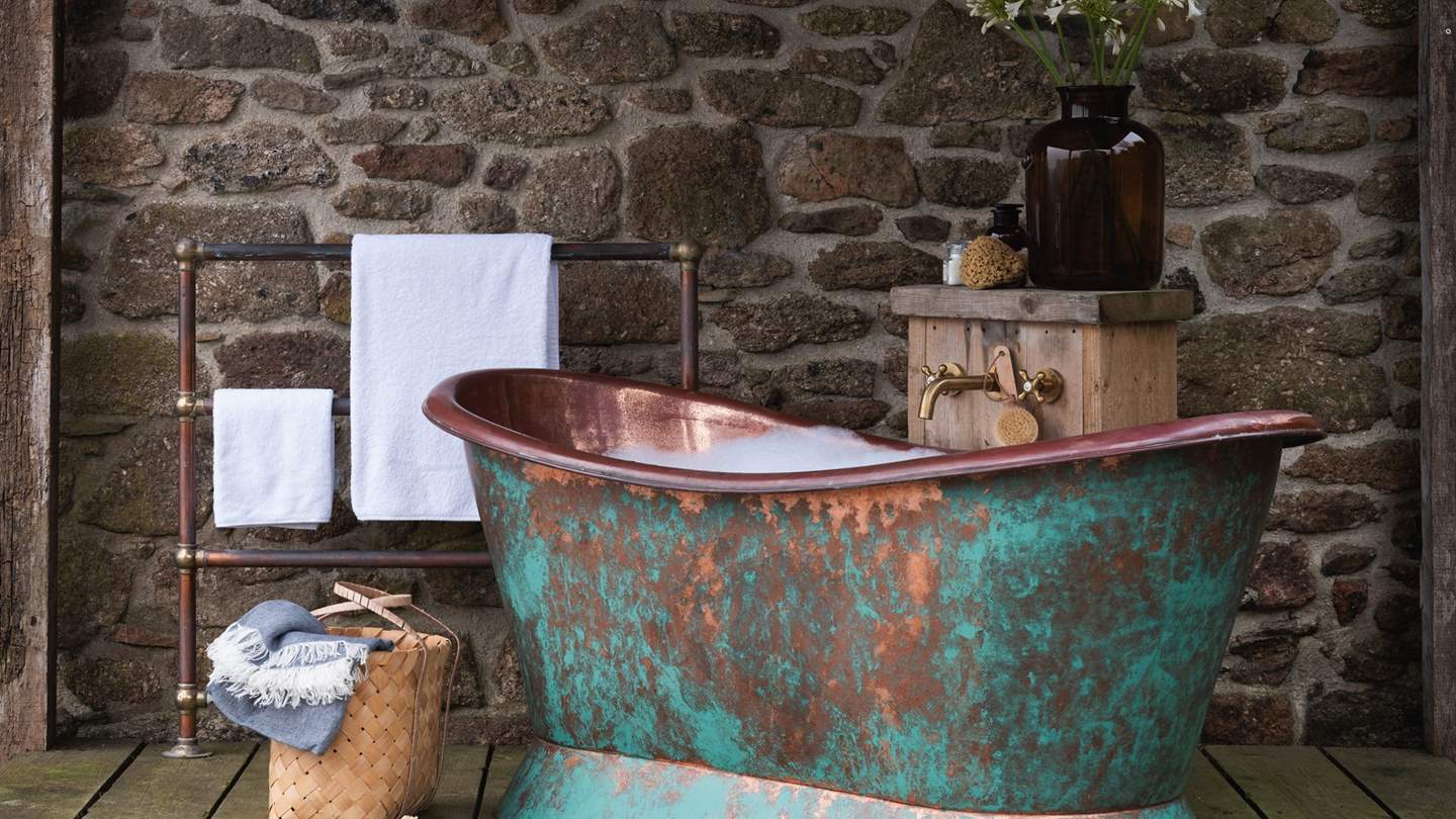 The pièce de résistance, a magnificent copper rolltop bathtub for otherworldly soaks alfresco