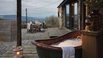 Savour moonlit soaks in the outdoor copper bathtub, which is available from May to September