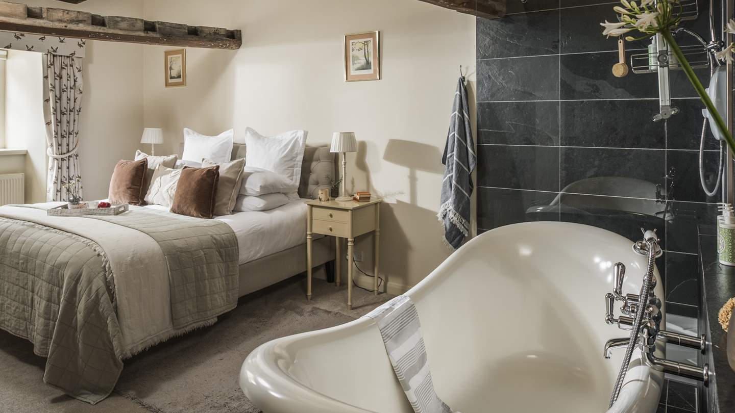 Framed by original wooden beams and period features, every inch of this darling space is curated with character and charm