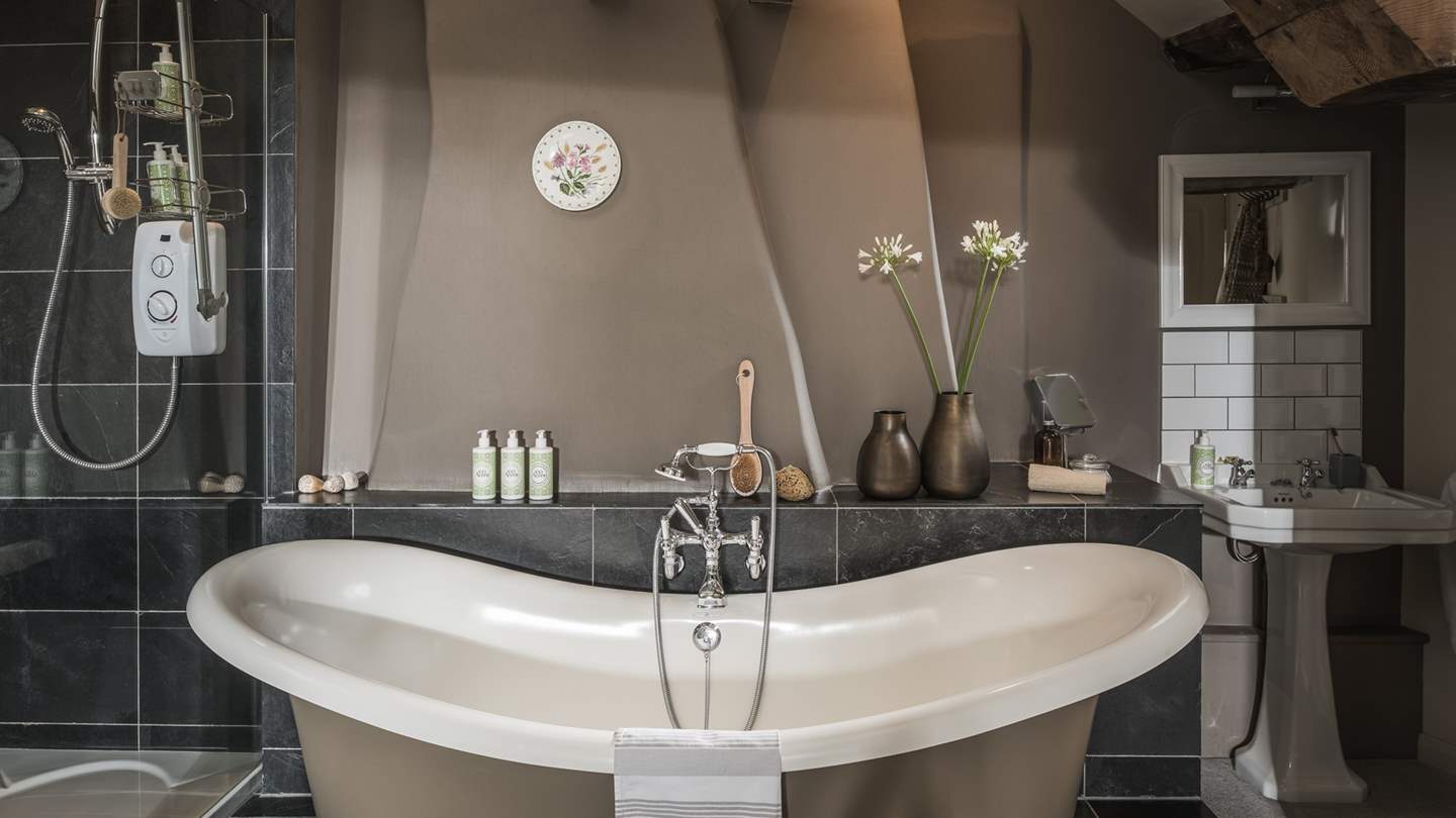 Savour blissful soaks in the darling slipper bath, set within the open plan ensuite bathroom 