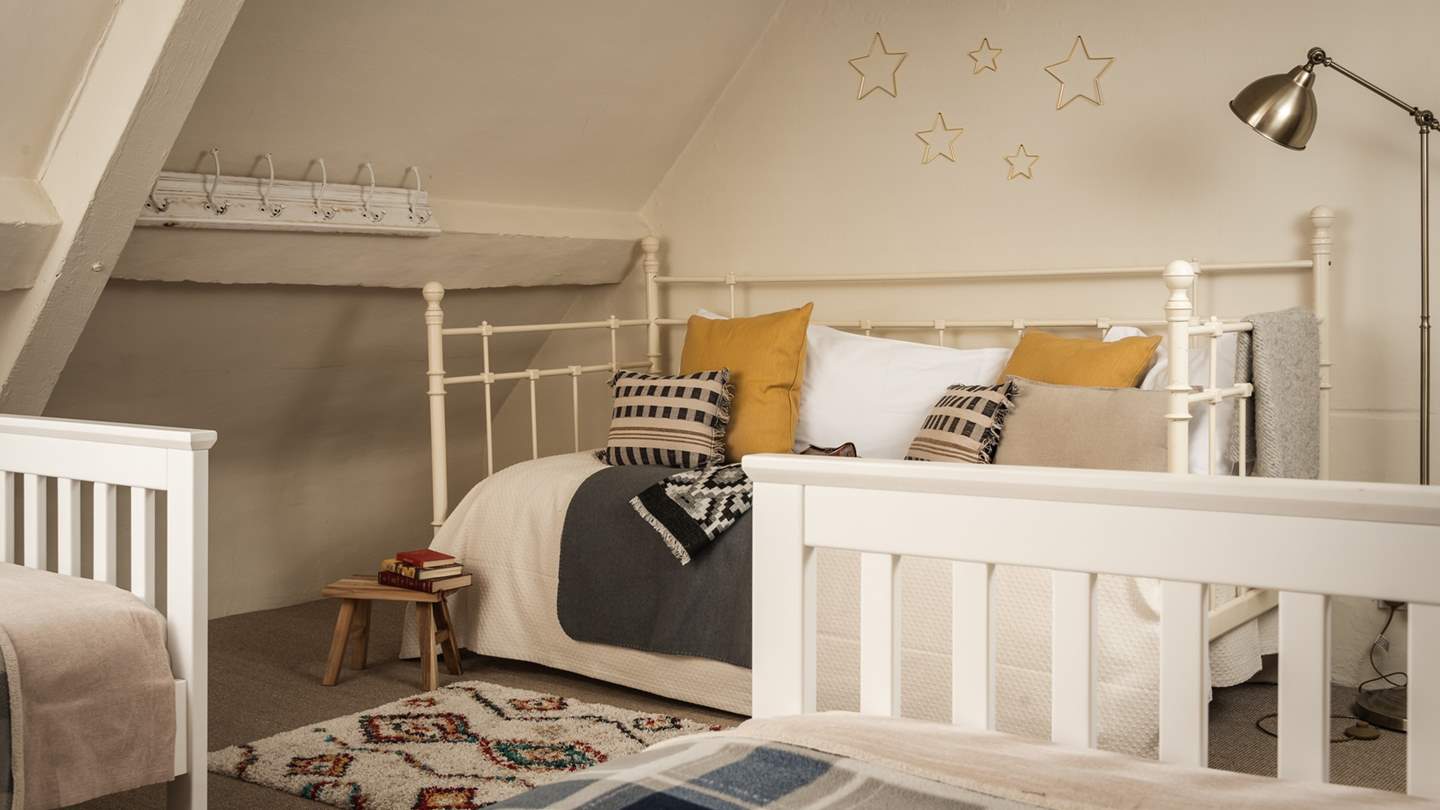 An ideal room for little ones, it features two single beds as well as a daybed,