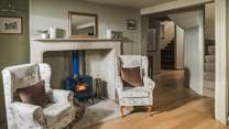 Seek cosy evenings gathered beside the gorgeous royal-blue wood burning stove...