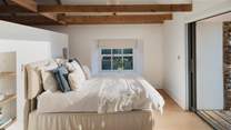 The master bedroom is stunning, it has a vaulted ceiling, a dressing area and an ensuite