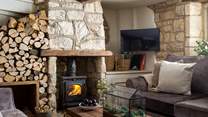 Beside the fire, you’ll find the characterful alcove for storing logs