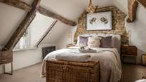 Set within the eaves of the second floor, you’ll find the stunning master bedroom