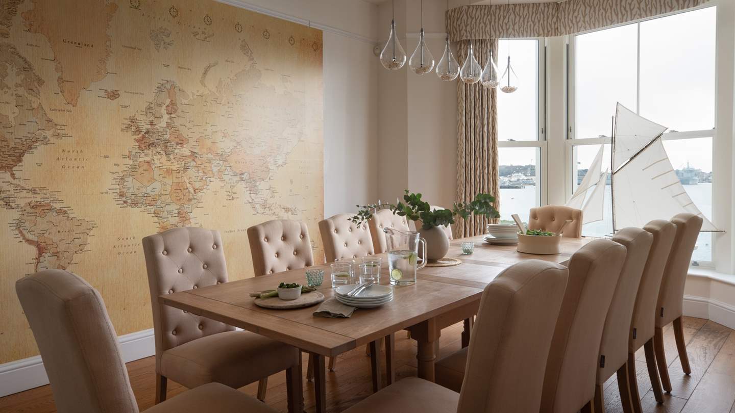 The formal dining room is a bright and airy space with a grand oak dining table which comfortably seats twelve