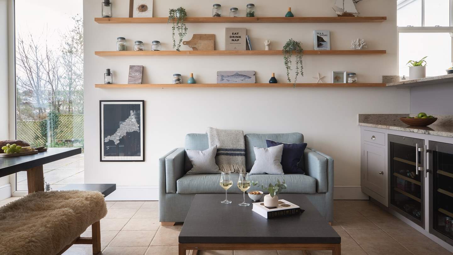 Beside the bar, there’s also a snug sofa and table to enjoy post-dinner tipples