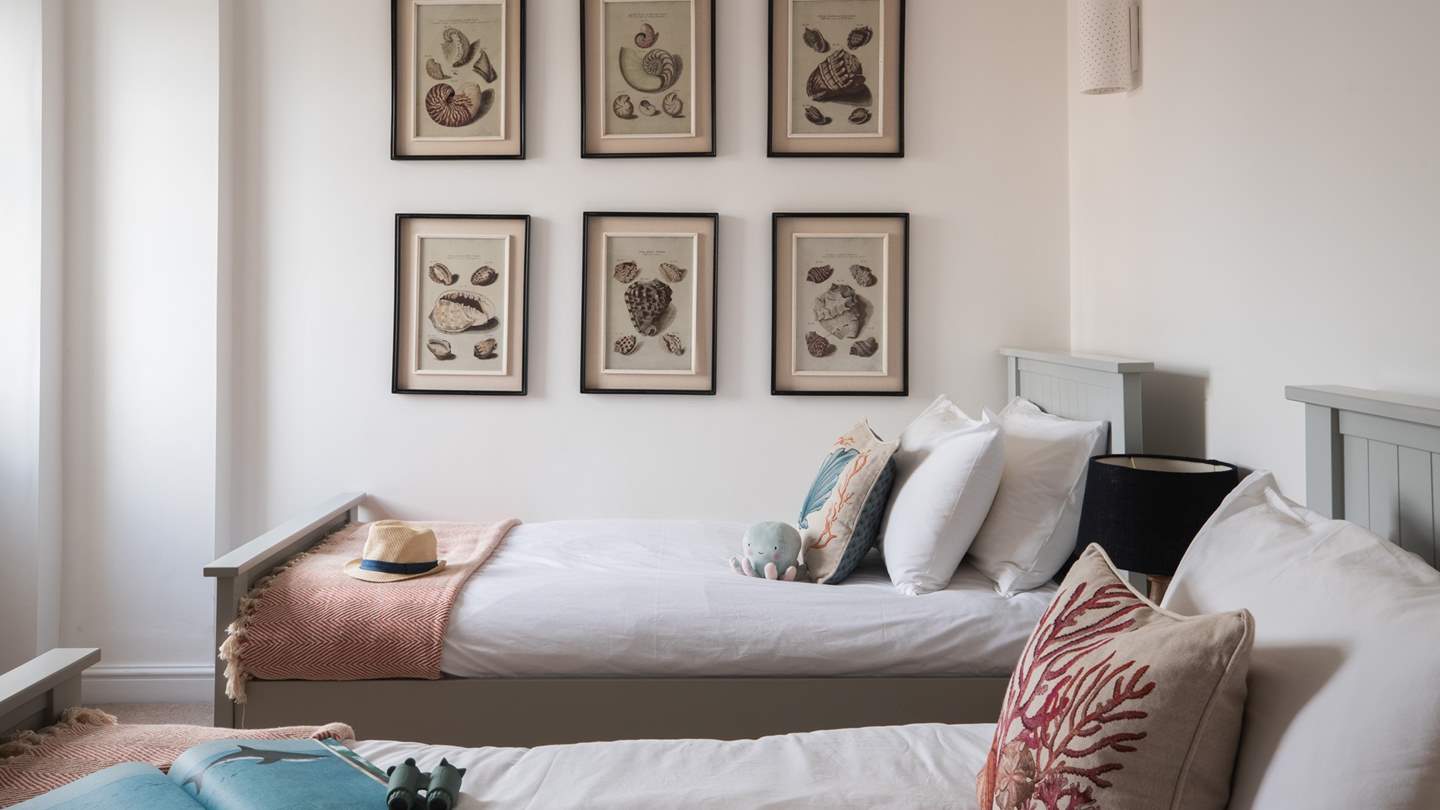 The sixth bedroom, with a charming coastal theme, is also on the top floor