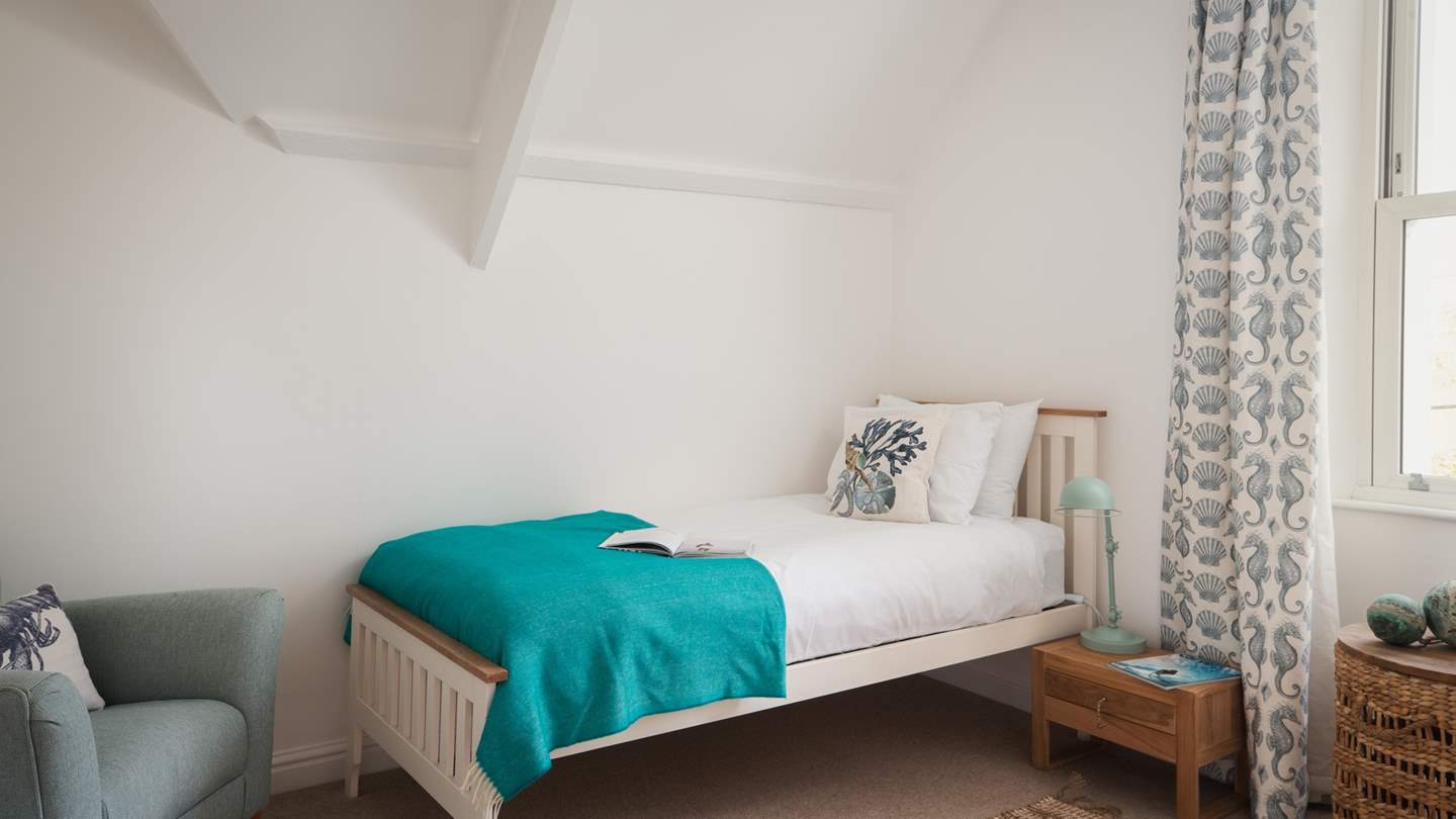 Bedroom seven is also situated on the second floor and is a calming, cosy room, with a single bed and a cute coastal theme