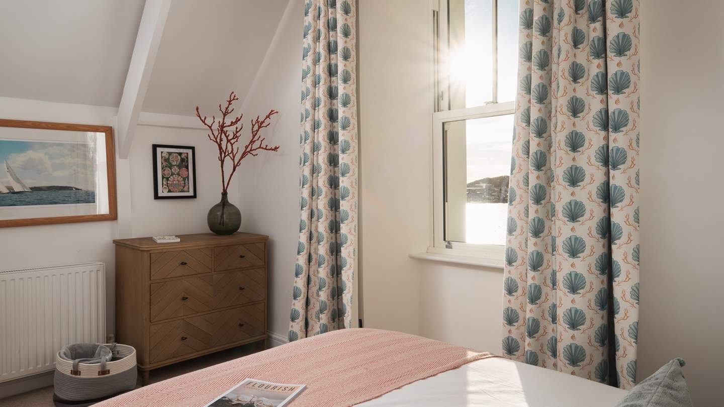 There’s a beautiful king-sized bed with a parquet style rustic headboard