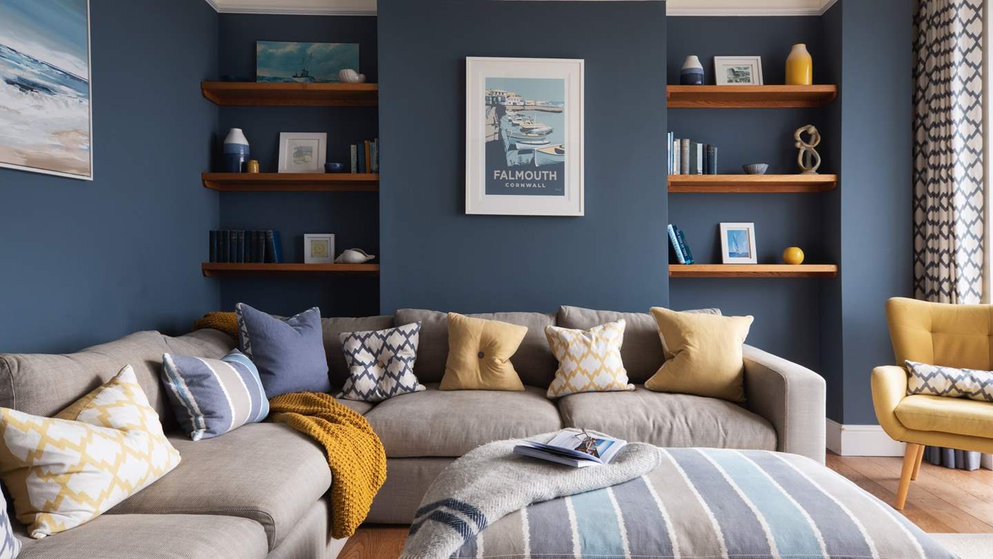 A large L-shaped sofa takes centre stage in the soothing sitting room